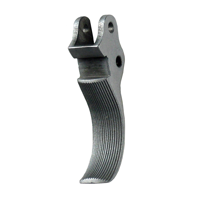 A close-up image of the TRIGGER PCR SERRATED, showcasing its metallic, curved design with serrated features. The trigger includes grooves for enhanced grip and a hole near the top for easy attachment. Its silver color is emphasized against a white backgro