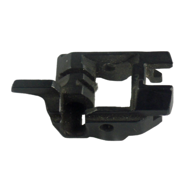 The DECOCKING EJECTOR #3 is a black component with an intricate design, featuring multiple cutouts and textured surfaces. It has angular edges and protrusions, suggesting it may be a part of larger machinery.