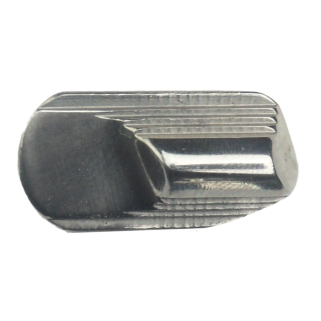 A close-up of the SAFETY LEFT STAINLESS 75 component showcases a smooth, reflective surface with linear grooves. Its elongated shape features a curved, concave area on one side, emphasizing intricate machining work.