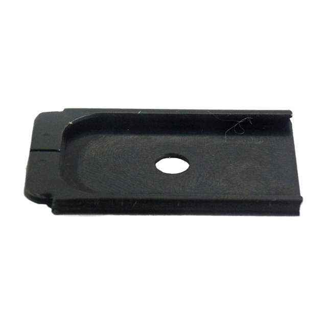 The product, resembling a black plastic SIM card tray with a rectangular shape and circular hole at its center, is actually the MAGAZINE BASE EXT MAG 16RD/26 RD. It features slightly raised edges and is photographed against a plain background.
