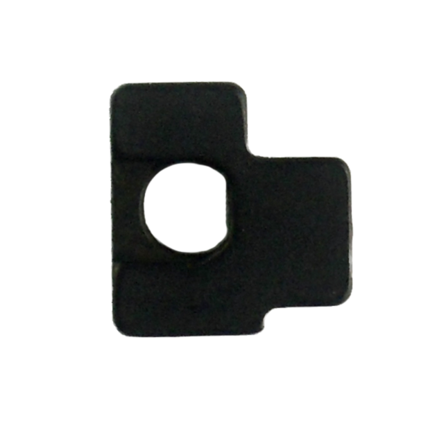A black metal bracket, with a square shape and central circular hole, features a protruding section on one side, creating an irregular outline that echoes the sturdy design of the FIRING PIN STOP KADET.