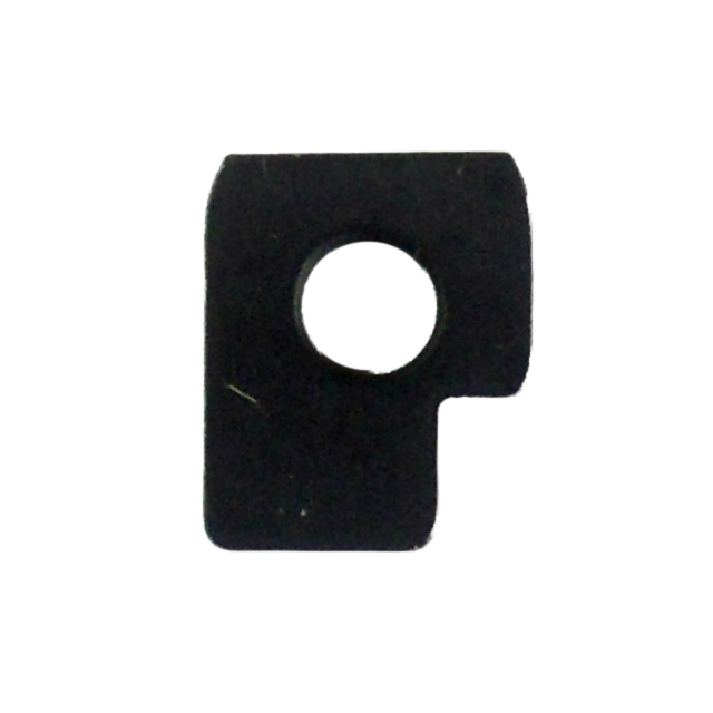 A flat, dark rectangular object with a round hole in the center and a small notch on one side, closely resembling the FIRING PIN STOP TASC SPORT/IPSC, isolated on a white background.