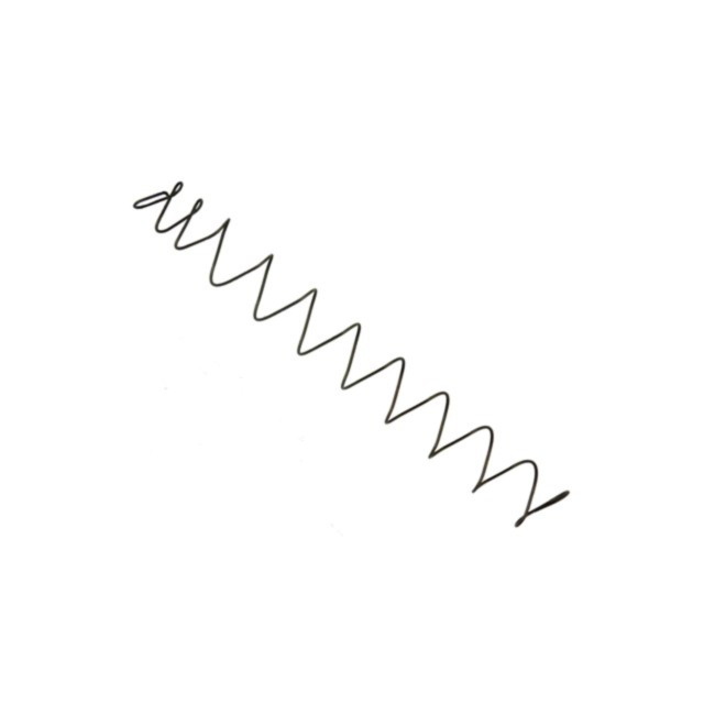 A long, black coiled spring, resembling the MAGAZINE SPRING TAC SPORT/IPSC 10 RD, is diagonally oriented against a pristine white background.