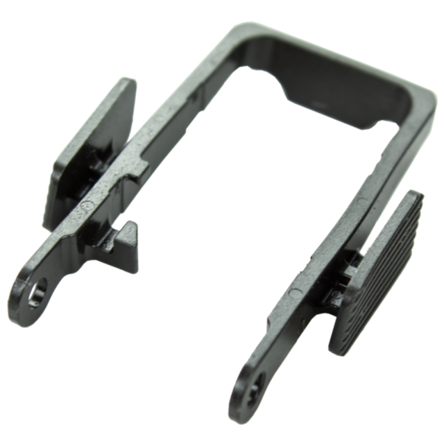 A black metal or plastic bracket with two prongs and a rectangular frame, featuring holes at the ends of each prong, has a slightly textured surface that suggests it's designed for mounting or holding components securely as part of the SLIDE STOP P-10 ass