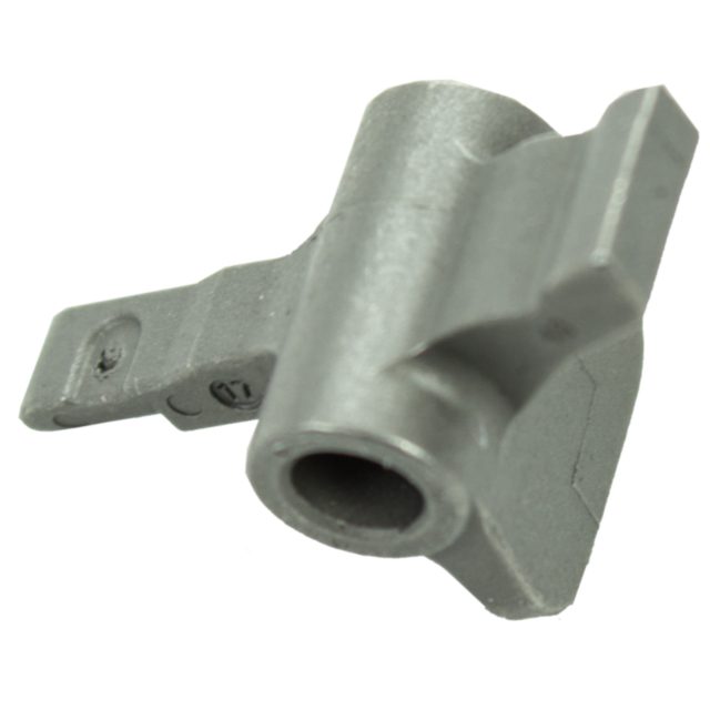 Close-up of the MAGAZINE CATCH P-10, a metallic mechanical component with a cylindrical hole. The piece showcases an angular design featuring a protruding section and small engraving, giving it an industrial or technical appearance.