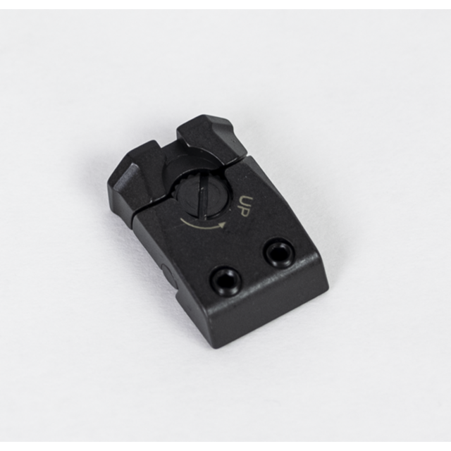 The ADJUSTABLE REAR SIGHT SHADOW 2 is a black mechanical component that has an adjustment dial labeled "UP" and two screw holes. It resembles a rectangular piece with rounded edges, casting a subtle shadow against a white background.