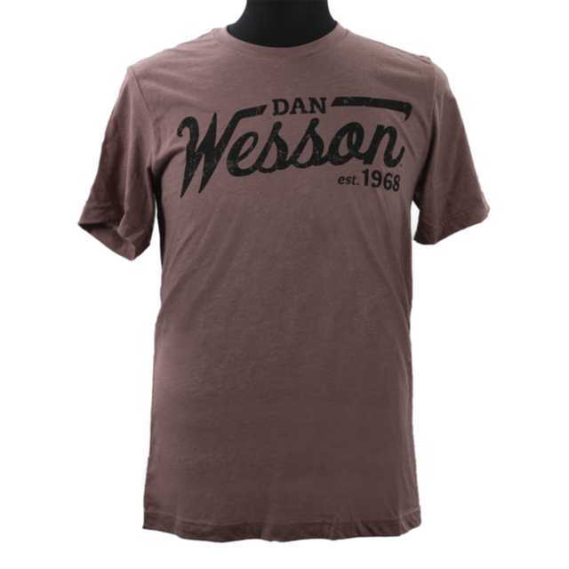 A mauve T-shirt displayed on a mannequin featuring distressed black text with "DAN WESSON est. 1968" across the front.