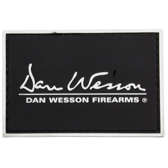Black DW Hook and Loop PVC Patch featuring bold "DAN WESSON FIREARMS ®" text with the handwritten text "Dan Wesson" above.