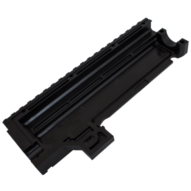 The LEFT RECEIVER COVER EVO 3 S1 SEMI AUTO BLACK is a black plastic component featuring multiple ridges and grooves, with a rectangular shape and an open section at one end. Its technical, industrial design suggests it is part of the larger mechanical or