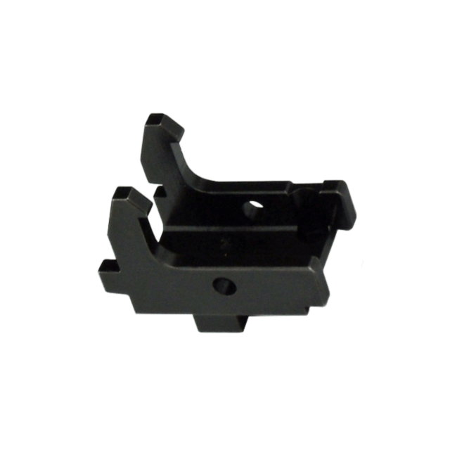 TRIGGER HOUSING EVO SEMI features a black metal bracket with angular, sharp-edged design, including two prongs on each side and a central hole. It is ideal for mounting or connecting components as an essential part of semi trigger housing solutions.