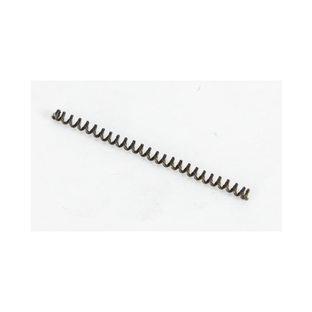 A close-up image of a small, black EJECTOR SPRING BREN 2 coiled metal spring lying on a plain white background, oriented horizontally across the image.
