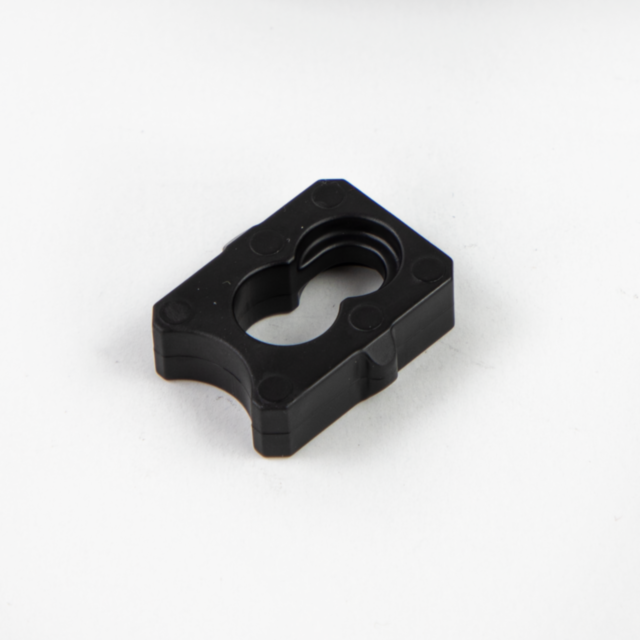 On a plain white background lies the BUFFER BREN 2, a black rectangular plastic component featuring rounded edges and a central cutout.