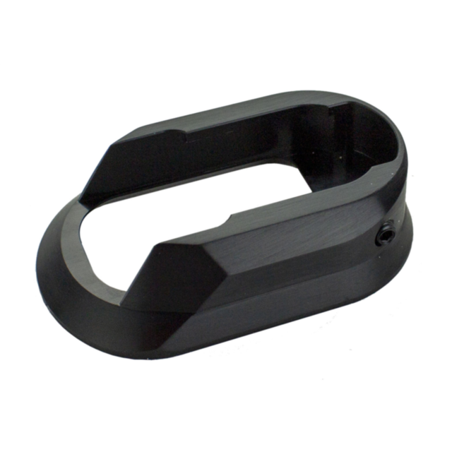 This black, oval-shaped aluminum component with a cutout center and angular sides is likely the ALUMINUM MAGWELL SHADOW 2 BLACK, known for its precision and robust design.