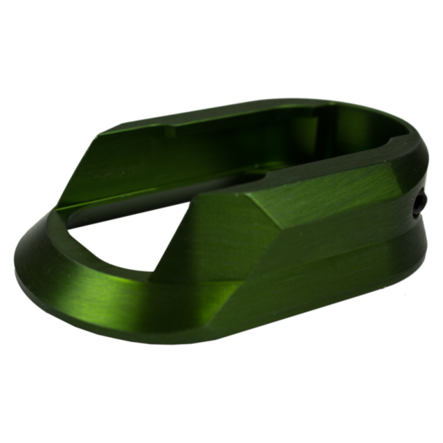 A piece resembling a mechanical component, featuring an angular aluminum design and a hollow rectangular opening, identified as the Aluminum Magwell Shadow 2 Green, is set against a white background.