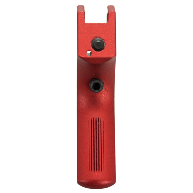 Close-up view of a red, vertical, cylindrical STRAIT SA TRIGGER CZUB object featuring two black circular elements, possibly a tool or part of a mechanical device, against a white background. The surface is designed with parallel grooves for grip.