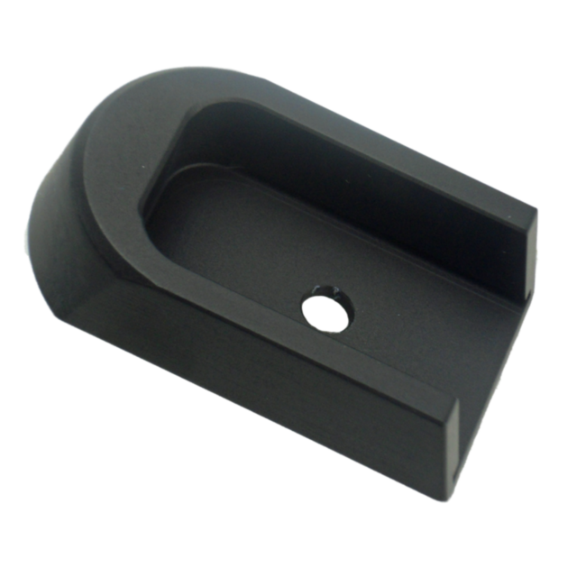 The BLACK ALUMINUM 40P/SP-01 BASE PAD is a U-shaped bracket made from black aluminum, featuring a flat base pad and a central hole, likely for mounting or attachment. Its surface is smooth and slightly reflective.