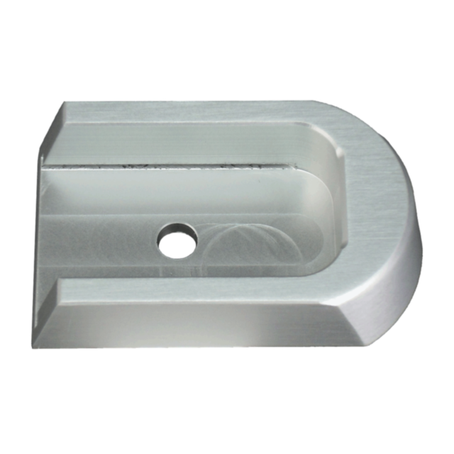 The SILVER ALUMINUM 40P/SP-01 BASE PAD has a curved edge and a rectangular slot in the center, along with a circular hole for mounting. Its surface reflects light to showcase its smooth, brushed finish.