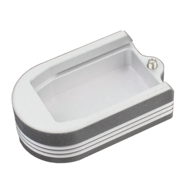 A rectangular, silver heatsink with a finned design and rounded end, featuring a small screw hole. It includes a central slot to accommodate components for thermal management, echoing the sleek style of the HENNING EXTENDED MAGAZINE BASE P-10 PLUS 2.