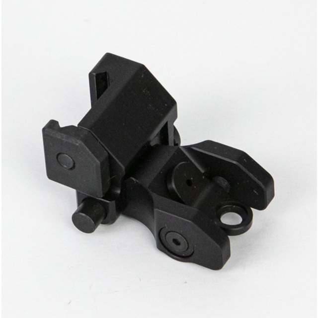 The REAR SIGHT - FLIP UP BREN 2 is a black metal bracket featuring multiple components. It has a triangular shape with adjustable screws and a circular hole, specifically designed for mounting or securing purposes. The product is presented on a plain whit