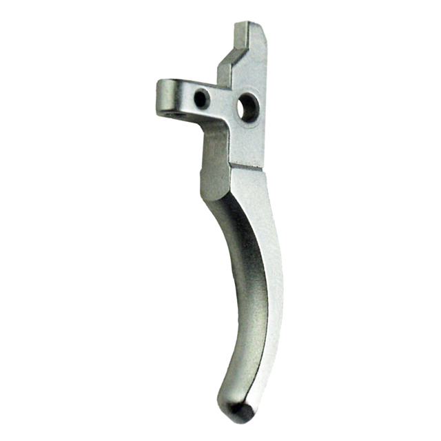 The 527/550 TRIGGER NEW STYLE is a silver component with an intricately shaped metal design, featuring a curved handle and an angular top. It includes two holes near the top and incorporates innovative elements that redefine functionality.