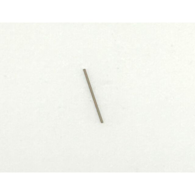 The Extractor spring CZ 600 Mini, a small, thin metal rod, lies diagonally on a plain white surface from the bottom left to the top right.