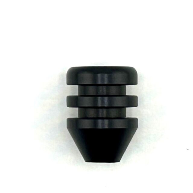 The Bolt knob CZ 600 Trail Aluminum, a black cylindrical object with a ridged design, features a wide, flat top and tapered bottom against a white background.