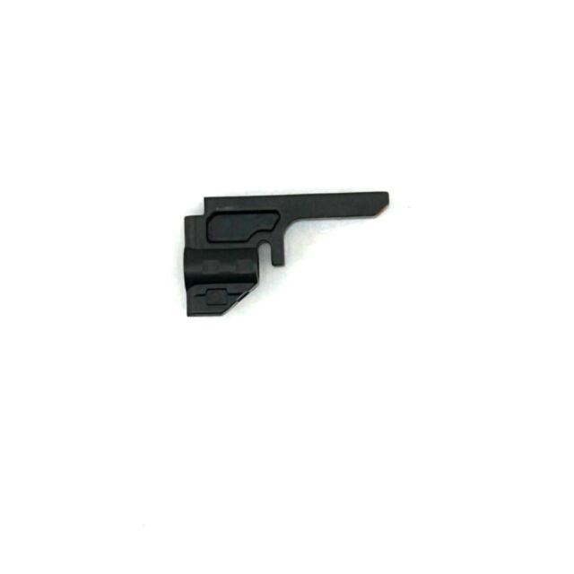 The Firing Pin Block CZ 600 Med/Long is a small, black mechanical component with a lever-like shape, angular sections, and a protruding arm, set against a white background.
