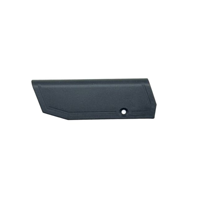 The CZ 600 Trail Cheekpiece is a black plastic component with a flat, rectangular shape and an angled edge. It has a single hole near one end and subtle geometric lines on its surface.