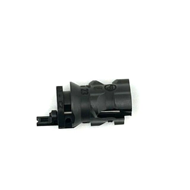 A small, gray, cylindrical Bolt head Assy CZ 600 224 with a protruding connector. Made of plastic or composite material, it features a notch and several grooves around its surface, isolated on a white background.