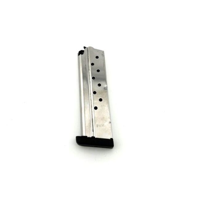 A MAGS 9 RD 9MM REMOVABLE BASE on a white background, featuring a silver body with a black base and multiple round indicator holes along the side.