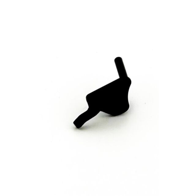A compact DWX Thumb Safety in a duty coat finish, featuring a small black angular metal piece with a protruding cylindrical rod and a curved section, set against a white background.