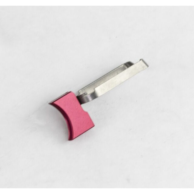 The DWX FULL SIZE TRIGGER ASM, MED. SOLID, R is a compact metal device featuring a red, curved handle and a silver metallic component displayed on a white background.