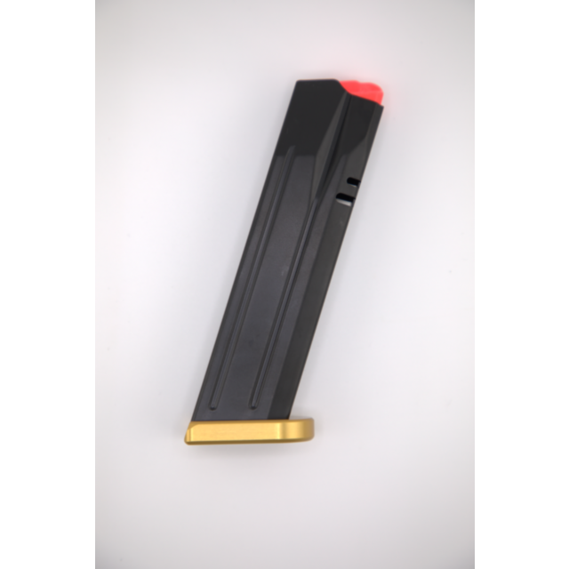 The MAG P10 F COMP READY, DWX Full 9MM 19RD GOLD BASE is shown on a white background, featuring a sleek black finish with a striking golden base and a red follower.