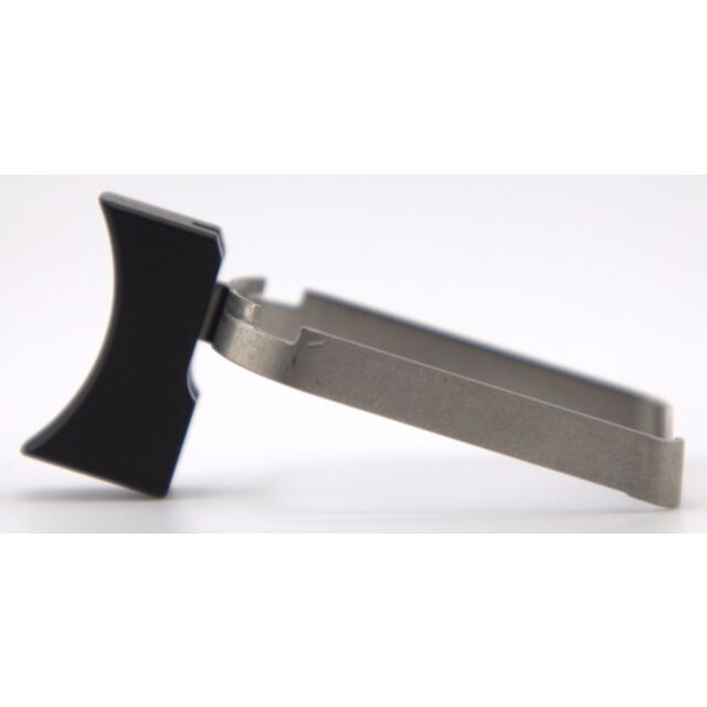 A DWX COMPACT TRIGGER ASM, SHORT CURVED,BL with a metal and black plastic clip featuring a flat, T-shaped handle is angled on a white background.