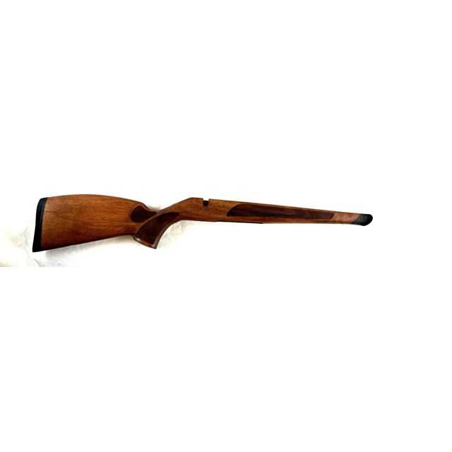 The Stock CZ 600 Lux Mini is a wooden rifle stock with a smooth finish, featuring a textured grip area and a black rubber butt pad, displayed horizontally against a plain white background.